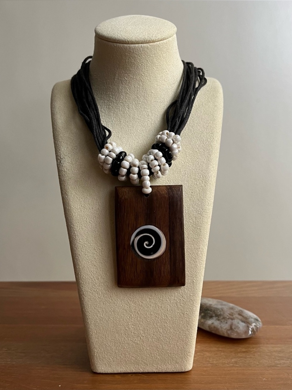 Handcrafted artisan-style jewelry piece necklace with black strings multi-strand